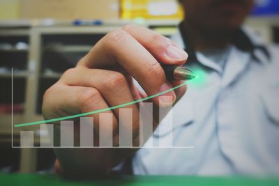 Close-up of person holding cigarette