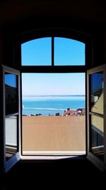 Close-up of sea seen through window