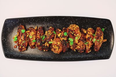 High angle view of food on table against white background