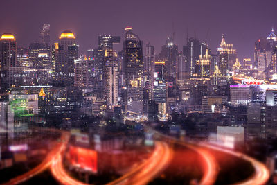 Illuminated buildings in city at night