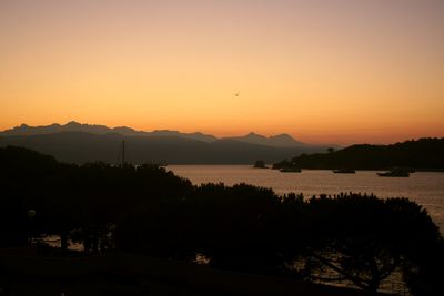 Scenic view of silhouette mountains against sky during sunset