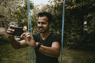 Young man using mobile phone