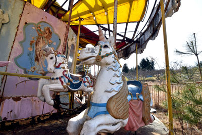 View of carousel horse in amusement park