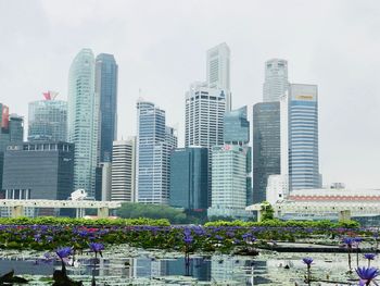 Modern buildings in city against sky