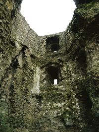 Low angle view of old ruin against clear sky