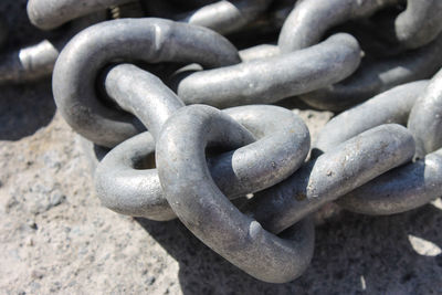 Close-up of chain on rock
