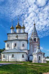 Church by building against sky