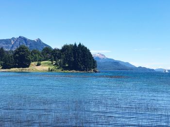 Scenic view of sea against blue sky