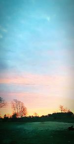 Scenic view of silhouette landscape against sky at sunset