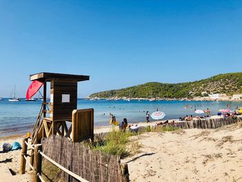 Scenic view of beach against clear sky