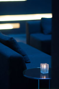 Close-up of chairs in illuminated room