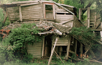 Old abandoned house by building