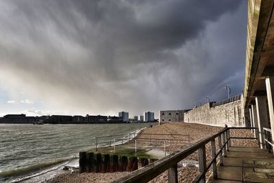 View of beach against cloudy sky