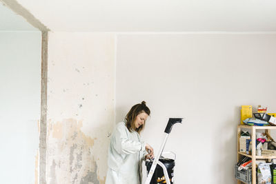 Woman renovating room