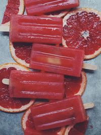 Close-up of popsicle sticks on blood orange