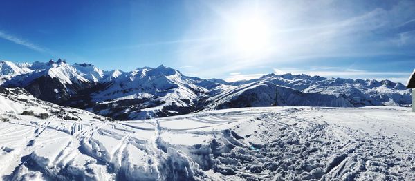 Scenic view of snowcapped mountains against sky