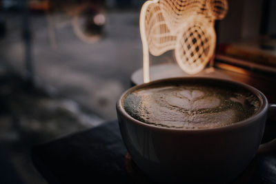 Close-up of cappuccino served on table