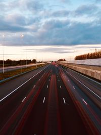 View of road against cloudy sky