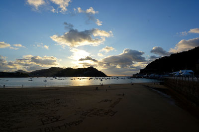 Scenic view of beach against sky during sunset