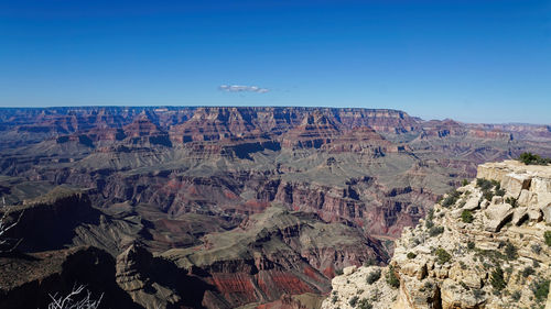 Aerial view of landscape with mountain range in background