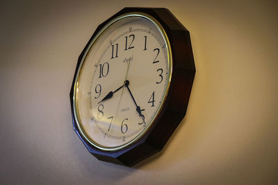 Close-up of clock on wall