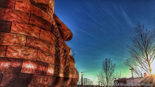 Low angle view of built structure against blue sky