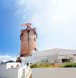 Low angle view of bell tower on building against sky