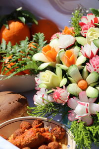 Close-up of food served on table with vegetable decoration