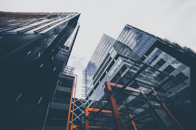 Low angle view of tall buildings against sky