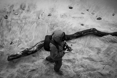 High angle view of person walking on snow