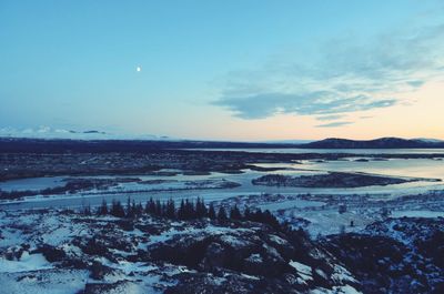 Scenic view of sea against sky during winter