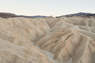 Scenic view of arid landscape against clear sky