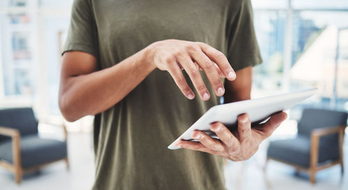 Midsection of woman using mobile phone