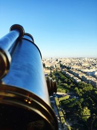 Close-up of cityscape against clear blue sky