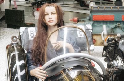 Portrait of young woman in car