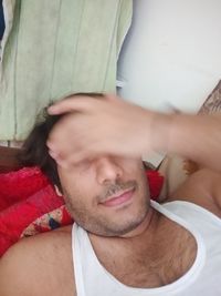 Close-up portrait of young man at home