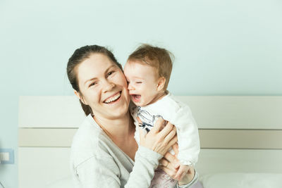 Portrait of happy mother and daughter