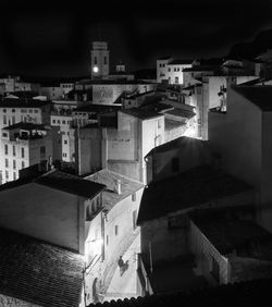 High angle view of buildings against sky at night