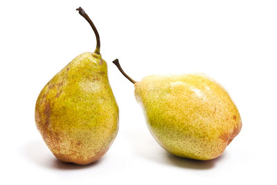 Close-up of fruits against white background