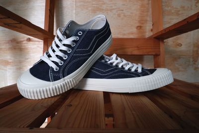 Close-up of shoes on hardwood floor