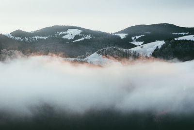 Scenic view of mountains against sky during winter