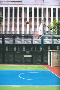 View of basketball court against building