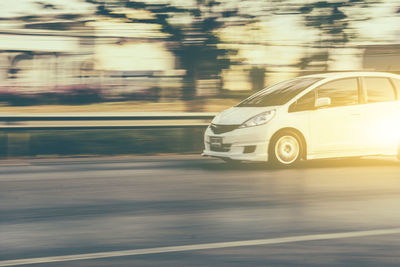 Blurred motion of car on road in city