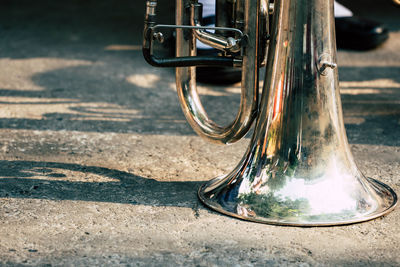 Close-up of trumpet on road