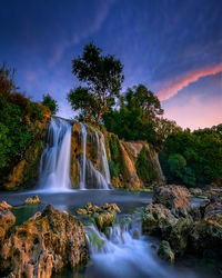 View of waterfall in forest