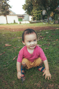 Portrait of smiling boy on field