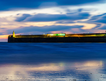 Scenic view of sea against sky at dusk