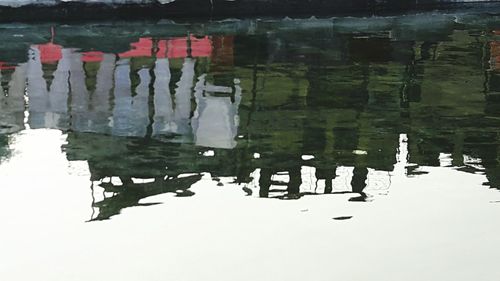 Reflection of building in puddle