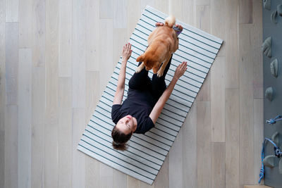 High angle view of man lying on floor