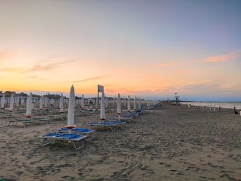 Scenic view of beach against sky during sunset